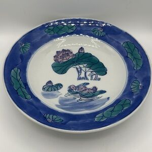 Chinese blue, white, and teal serving bowl with birds and lily pads